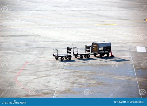 a baggage carrier at an airport figgerits|A baggage carrier at an airport .